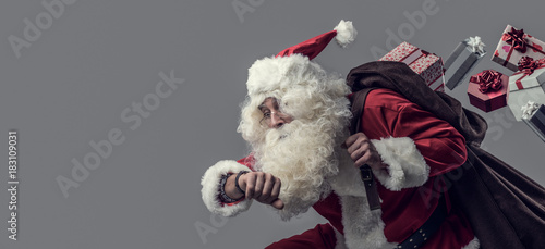 Santa Claus running and del...