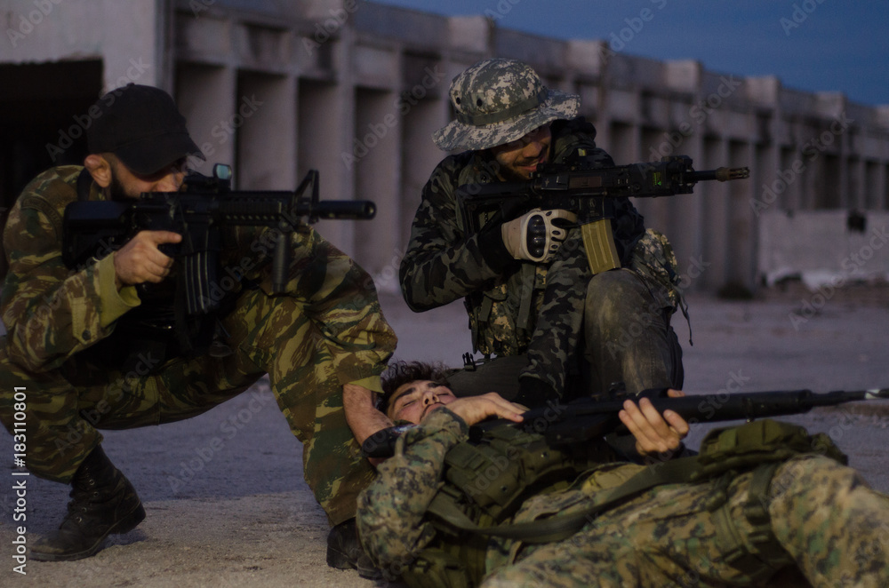 Fototapeta premium group of soldiers protect and rescue crow