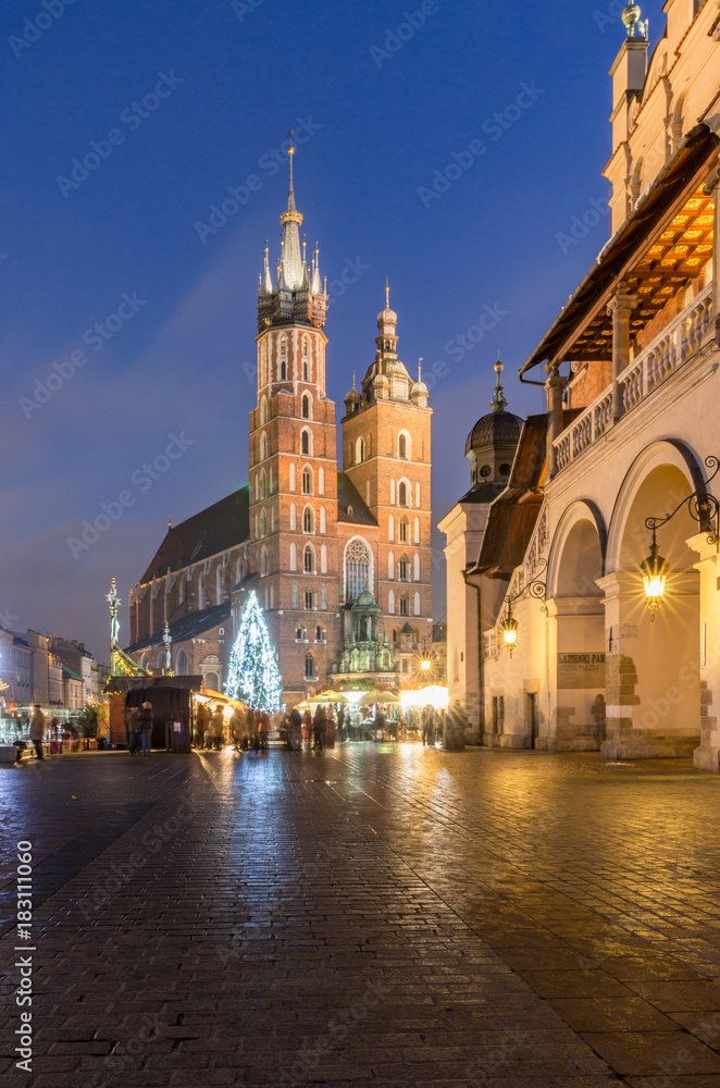 Christmas tree, St Mary's church, Cloth Hall on Main Market Square in Krakow, illuminated in the night