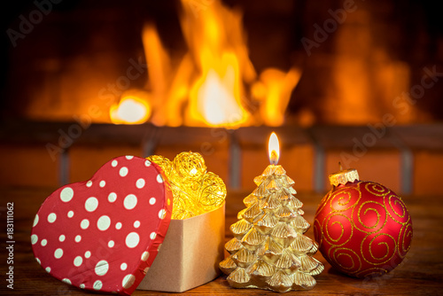 Christmas tree decorations near fireplace
