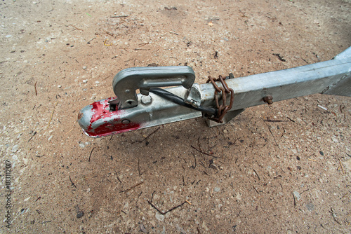Old metal trailer attachment with rusty chain