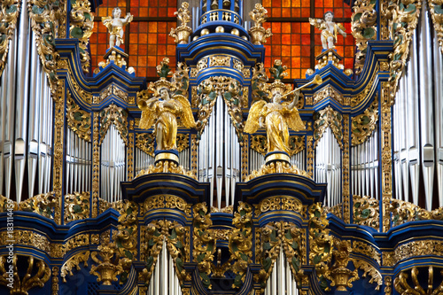 Fragment of organ in church in Saint Lipka with nice pipes and carved angels © Pawel Horazy
