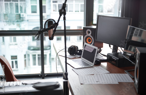 Obraz na płótnie Modern computers, microphone near table in sound recording studio