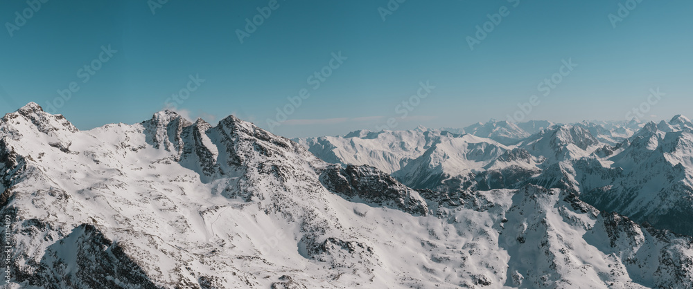 Panorama of alpine landscape covered in snow