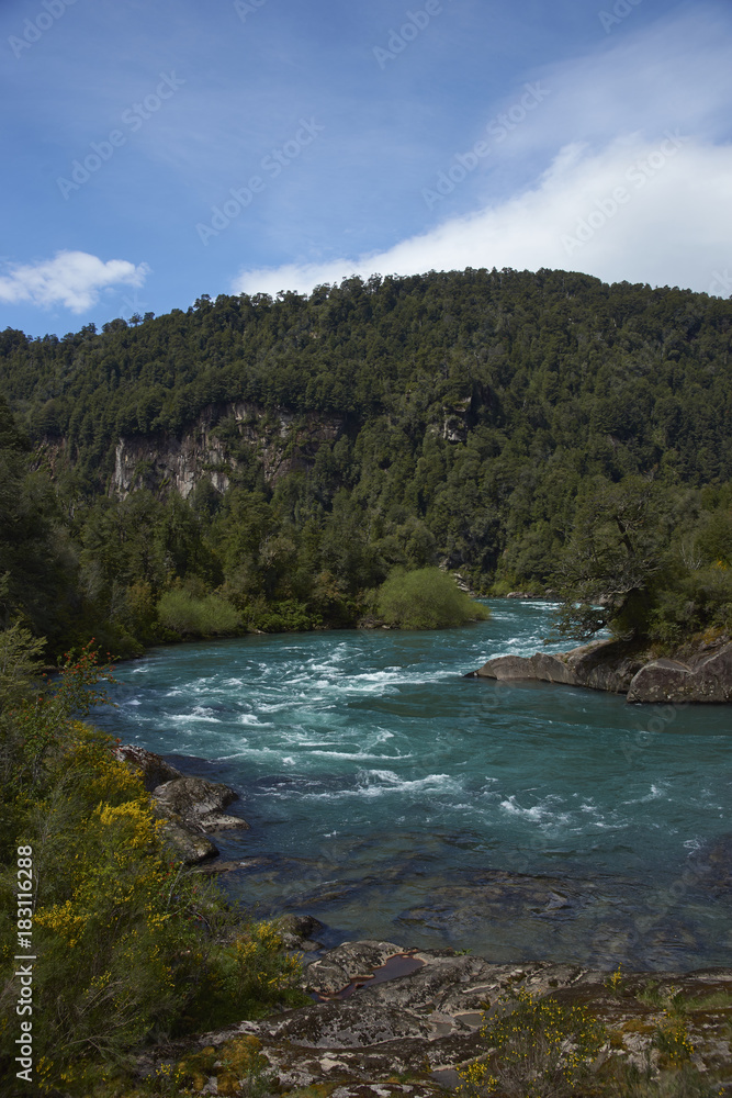 River Futaleufu flowing through a forested valley in the Aysén Region of southern Chile. The river is renowned as one of the premier locations in the world for white water rafting.