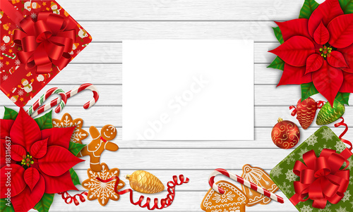 Horizontal mock-up with Christmas items and paper sheet for your design. Poinsettia, gingerbread cookies, candy canes, Christmas ornaments and gift box on the white wooden background. Top view.Vector