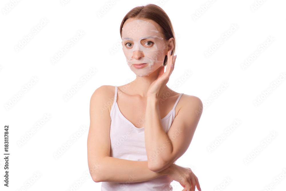 Beautiful young woman a tissue mask on her face beauty cosmetics Beautiful young woman a tissue mask on her face beauty cosmetics
