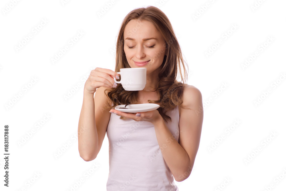 Beautiful young woman holding a white cup and saucer with coffee tea Beautiful young woman holding a white cup and saucer with coffee tea