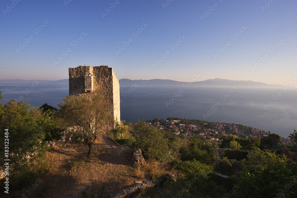 Abandoned stone mediaeval village in the Biokovo mountains in balkan country Croatia in Dalmatia region with beautiful view on the Adriatic sea. Picture taken in hot summer day at the sunset.
