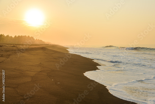 Sunset at Beach with Black Sand in Monterrico  Pacific coast of Guatemala. 