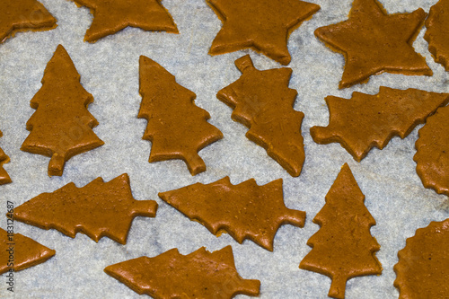 Cooking and decorating christmas gingerbread. Homemade gingerbread cookies, forms and baking ingredients photo