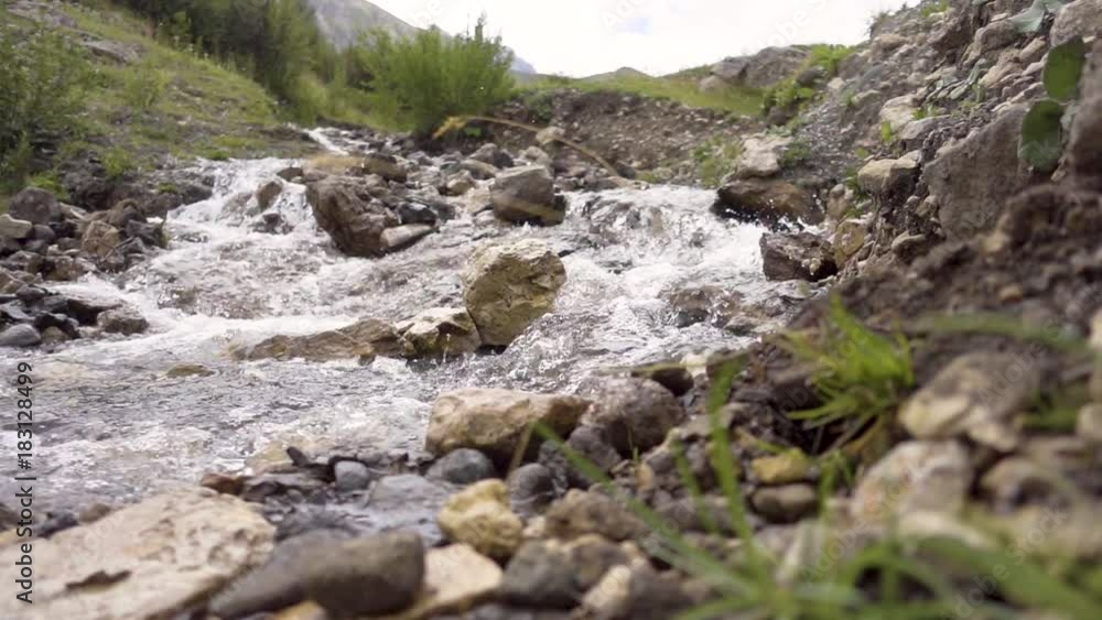 240 fps slow motion creek with flowing water sparkling near Alpe di Siusi 240 fps slow motion creek with flowing water sparkling near Alpe di Siusi