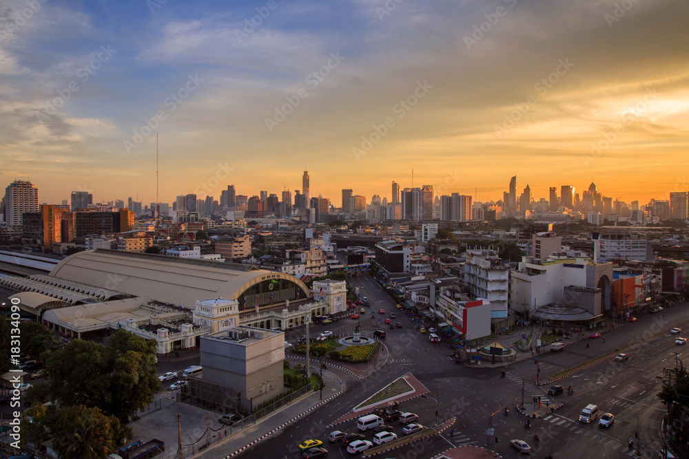 Aerial view Hua Lamphong train station and modern office buildings in Bangkok city downtown with sunrise time, Bangkok Province, Thailand