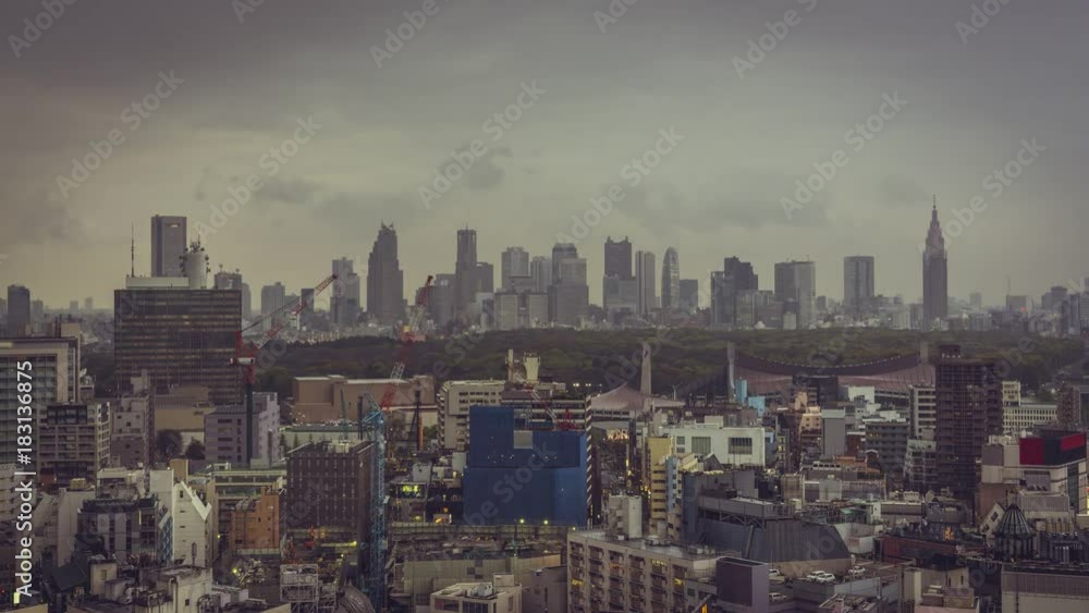 Tokyo city skyline with skyscrapers and Yoyogi Park, Japan. Time lapse with rolling clouds and rain over Tokyo. Vintage colors Tokyo city skyline with skyscrapers and Yoyogi Park, Japan. Time lapse with rolling clouds and rain over Tokyo. Vintage colors