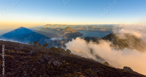 Panorama view of Lake Atitlan and volcano San Pedro early in the morning from peak of volcano Atitlan  Guatemala