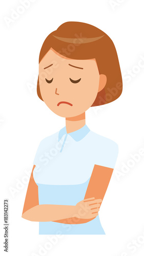 A woman nurse wearing a white uniform is depressed