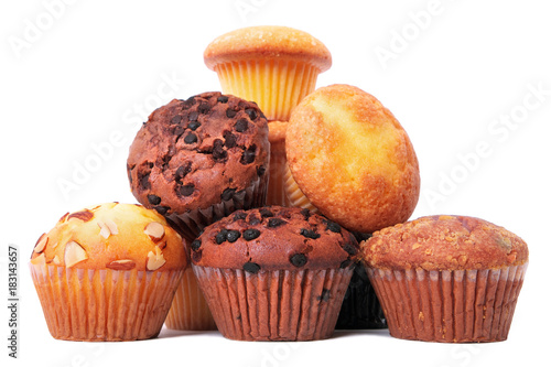 Muffin chocolate chip cup cake or cupcake various flavor several lots many pile heap isolated on white background photo