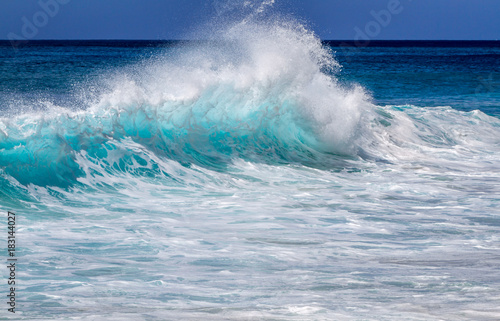 Aqua blue wave on the west side of Oahu Hawaii