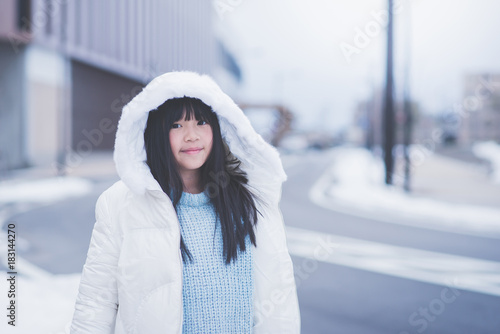 Beautiful asian girl waking in the street photo