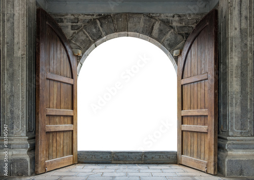 Large wooden door open in castle wall