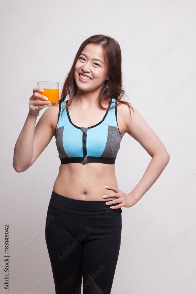 Beautiful Asian healthy girl drinking orange juice. Beautiful Asian healthy girl drinking orange juice.