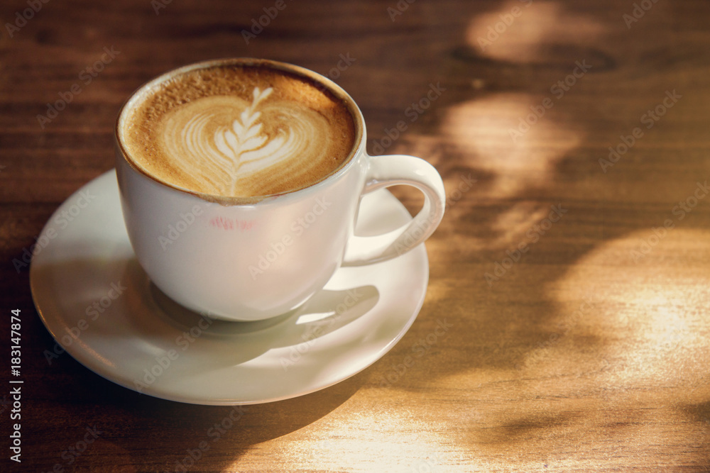 Lipstick mark on a cups of coffee on rustic wooden table background. Coffee Break Recreation Relaxation Concept. Selective focus. Lipstick mark on a cups of coffee on rustic wooden table background. Coffee Break Recreation Relaxation Concept. Selective focus.