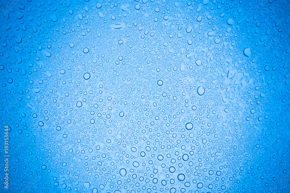 Rain droplets on blue glass background, Water drops on glass. Rain droplets on blue glass background, Water drops on glass.