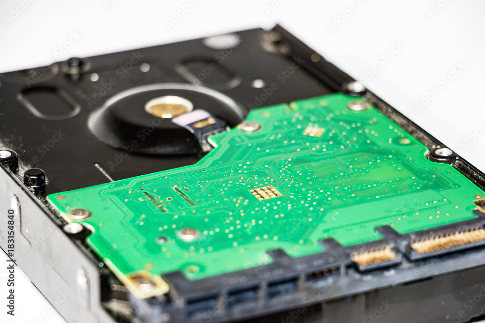 The back side of the hard drive. Internal part of the hdd. Selective focus The back side of the hard drive. Internal part of the hdd. Selective focus