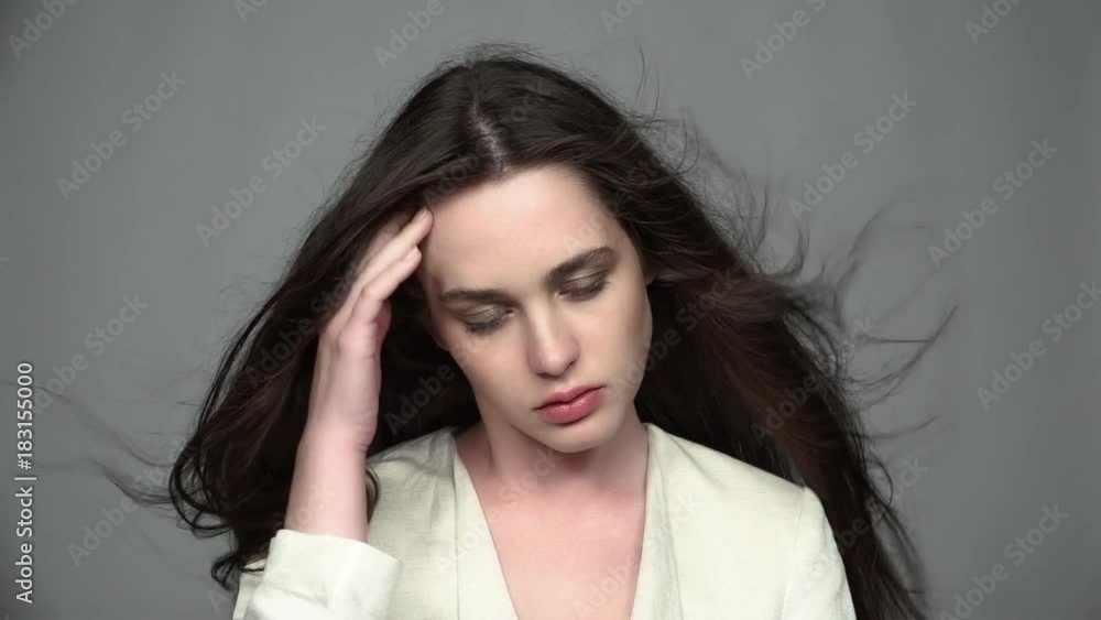Slow motion video portrait of beauty young brunette woman with green eyes and streaming hair Slow motion video portrait of beauty young brunette woman with green eyes and streaming hair