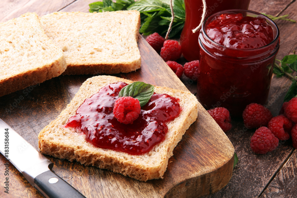 Fresh raspberry jam with toast or bread for breakfast. Fresh raspberry jam with toast or bread for breakfast.