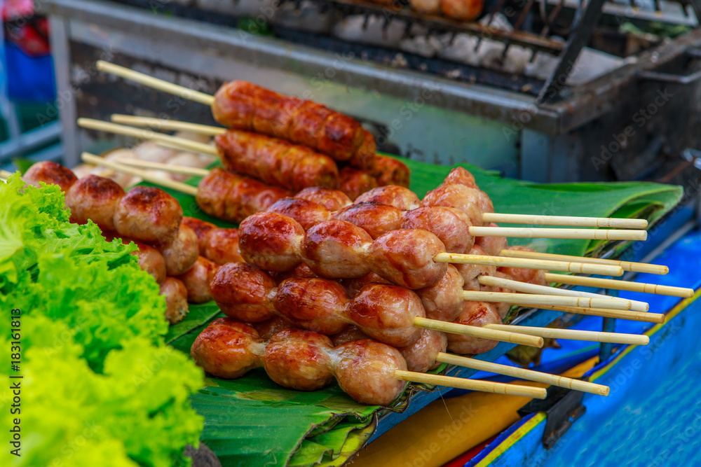 The pork sausage, fast food on the footpath. The pork sausage, fast food on the footpath.