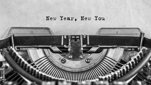 New Year New You message typed on old vintage typewriter. Cloce up