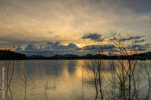 Beautiful sunset on  lake in the hill.