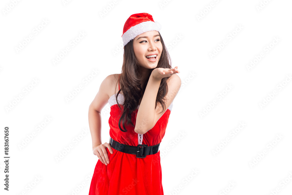 Christmas Woman. Beauty Asian Model Girl in Santa Costume isolated on White Background. Christmas Woman. Beauty Asian Model Girl in Santa Costume isolated on White Background.