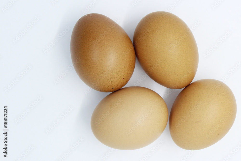 Close-up view of organic Brown Eggs on Plastic Egg Carton isolated on white background Close-up view of organic Brown Eggs on Plastic Egg Carton isolated on white background