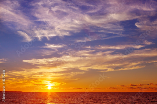 Beautiful marine sunset with orange Cirrus clouds