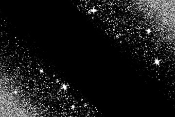 Silver glitter with glowing sparks on black background