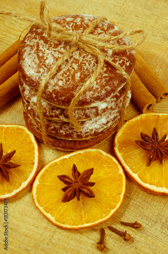 Gingerbread cookies, cinnamon and orange slices. Christmas decoration.