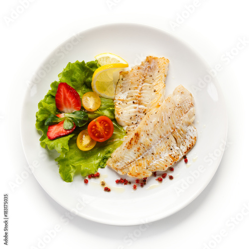 Canvas Print Fish dish - fried fish fillet and vegetables