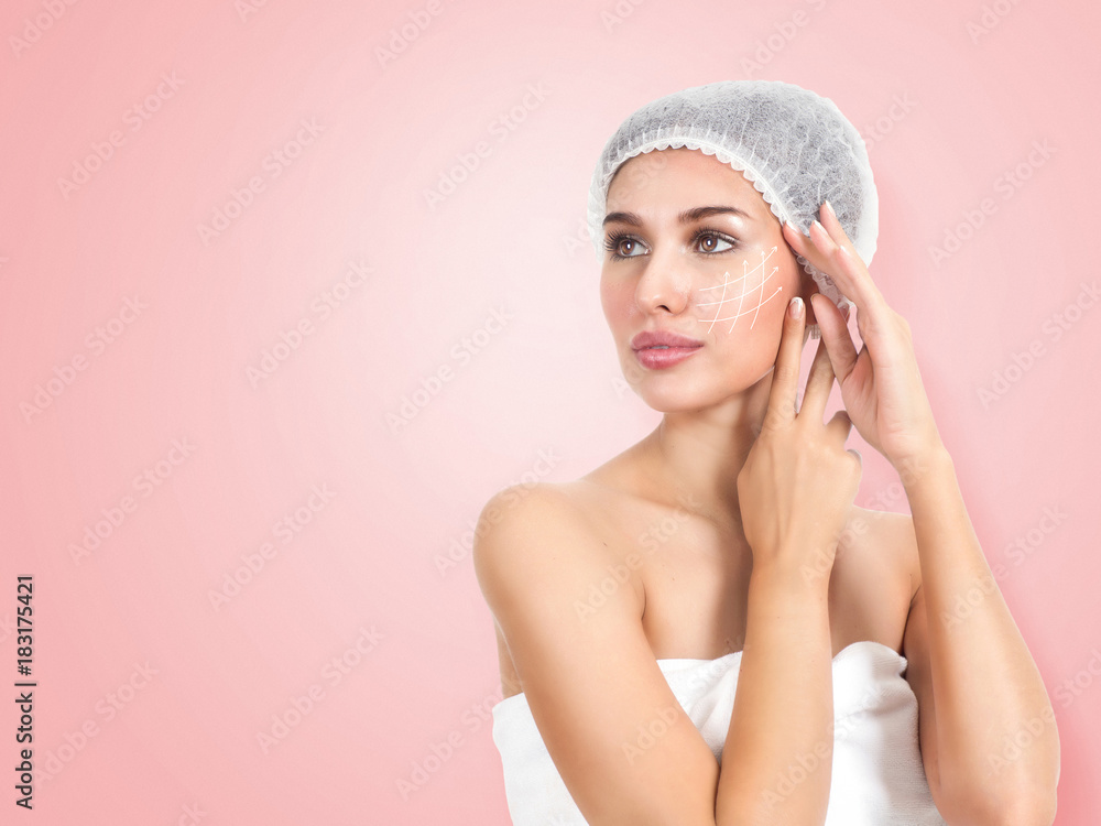 Portrait of beautiful and healthy woman with arrows on her face. Beauty, medicine, plastic surgery and skin care concept. Portrait of beautiful and healthy woman with arrows on her face. Beauty, medicine, plastic surgery and skin care concept.