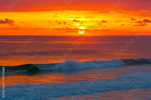 Fototapeta Naklejka Na Ścianę i Meble -  Beautiful sunrise over the quiet calm sea.