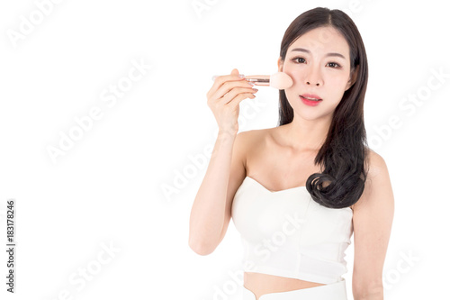 Woman holding make-up brushes isolated on white background