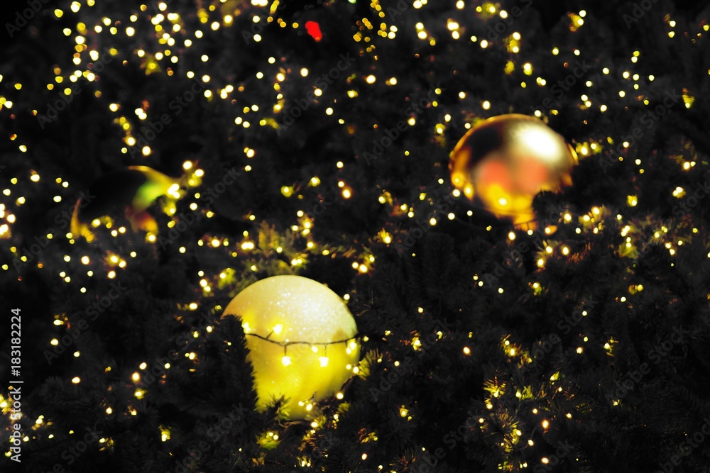Light bright blurred bokeh and shiny ball at night , background, planets in galaxy for Christmas day ,New Year , greeting and celebrate season