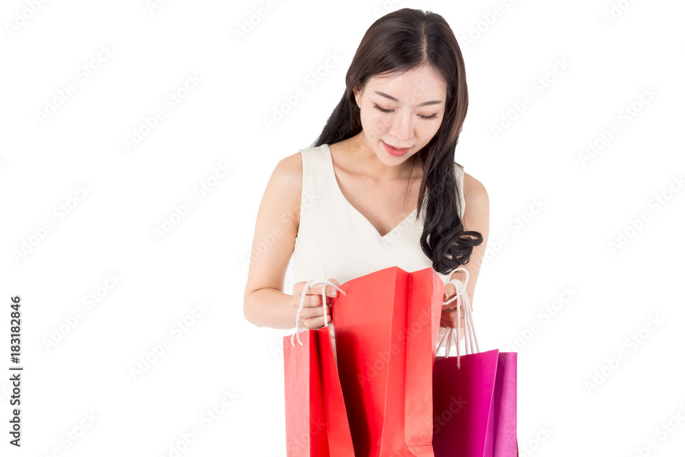 Happy woman holding shopping bags isolated on white background Happy woman holding shopping bags isolated on white background