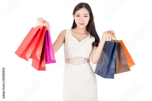 Happy woman holding shopping bags isolated on white background
