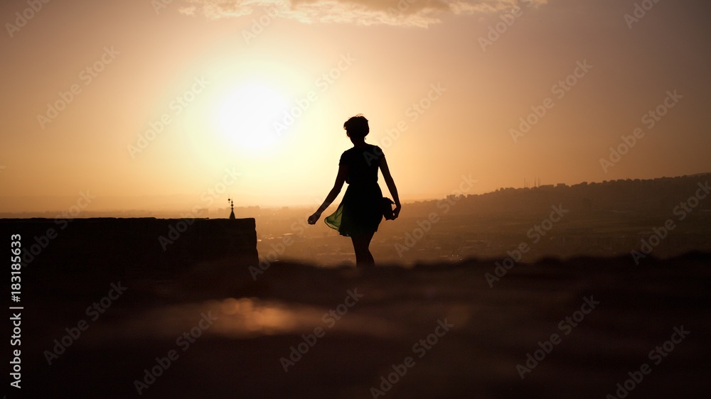 Silhouette of female person on the top of Castle in Ankara, Turkey