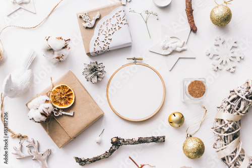 Flat lay top view Christmas photo with an embroidery hoop and cute decoration.