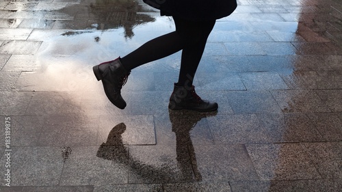 Quadro su tela Female walking after the rain.