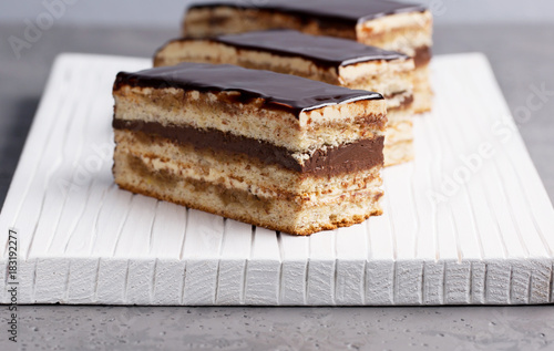 Cake Opera on a gray background, vertical, selective focus