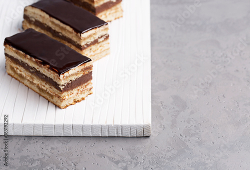 Cake Opera on a gray background, vertical, selective focus